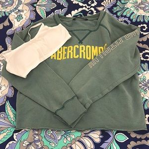 A white bra and a sage green cropped sweatshirt from Abercrombie.